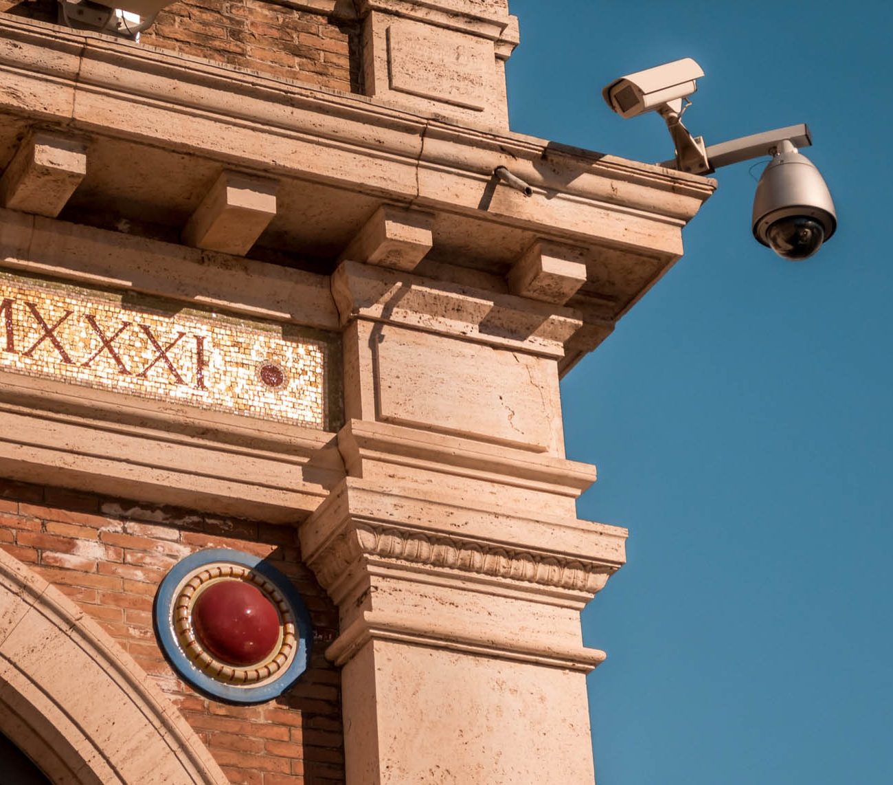 Outdoor CCTV cameras mounted on a heritage building for external surveillance by K9 Security Services Ltd